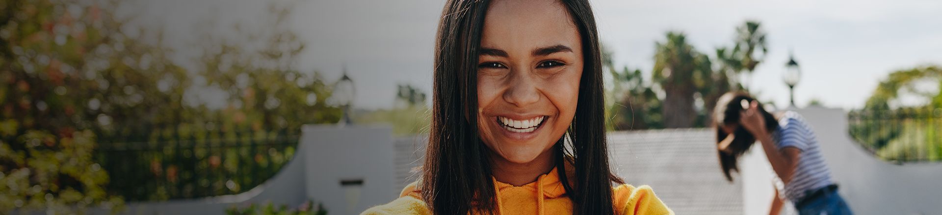 Smiling young woman with nice teeth from Cosmetic Dentistry in Longview Texas