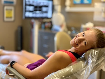 woman in dental exam chair getting a consultation for clear braces in Longview