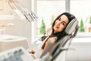 Woman smiling at camera from the dental chair